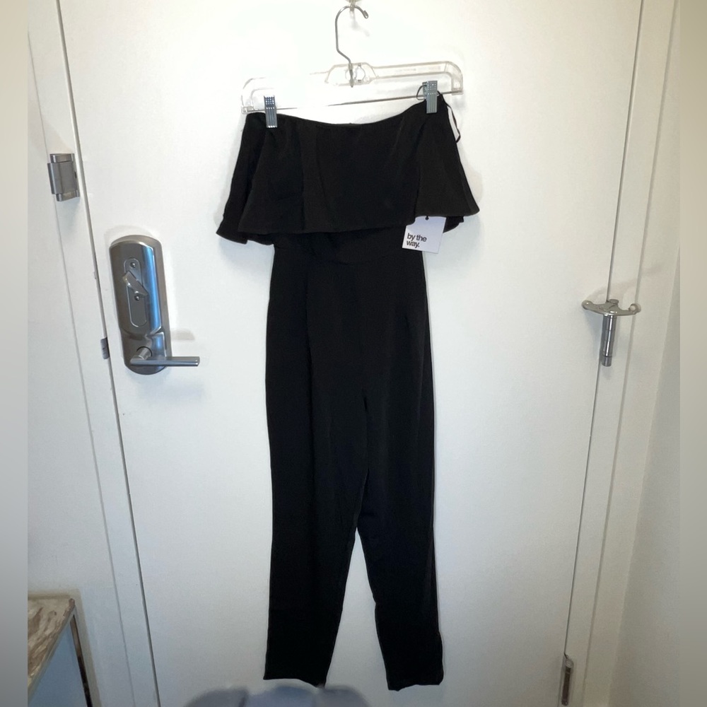 By the way Reina ruffled jumpsuit.